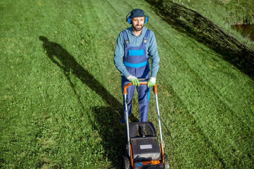 gardener working with lawn mower on the backyard 2025 03 16 09 40 17 utc min scaled